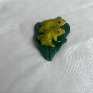 Green Twin Frog Figurine on Leaf